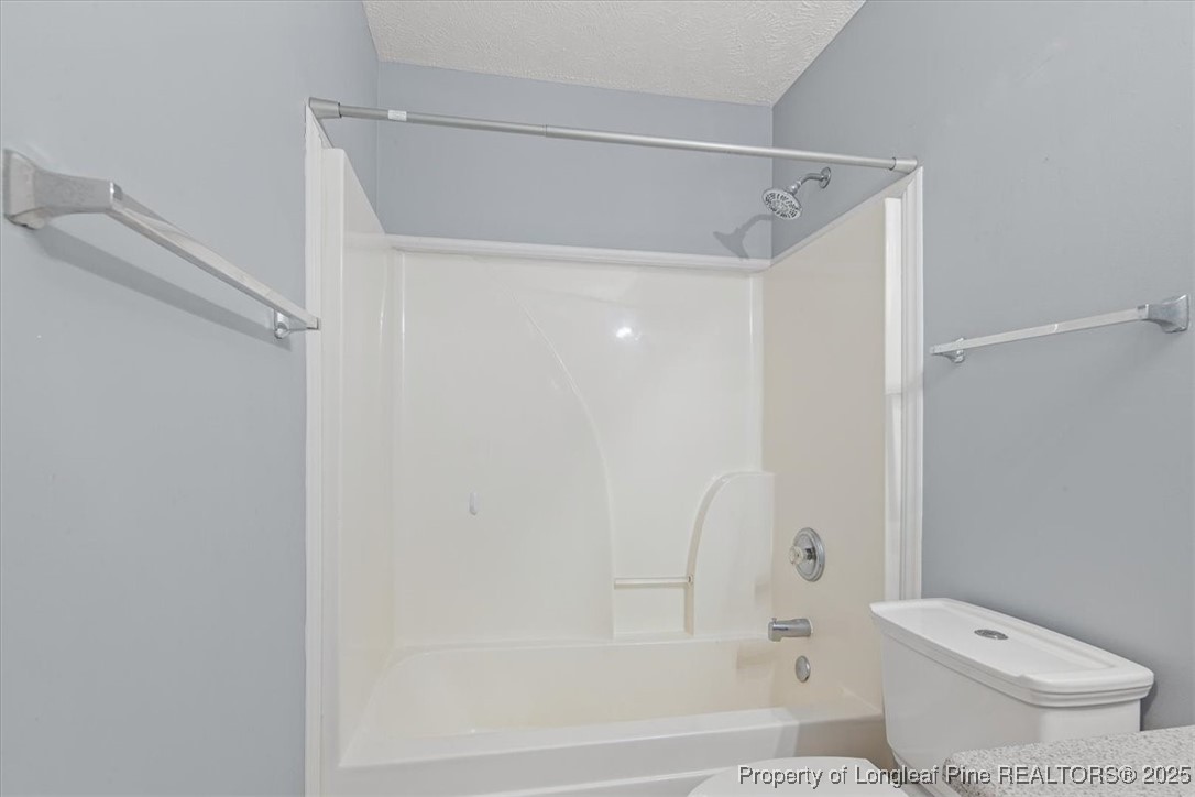 103 Beaumont Court Raeford, NC 28376 - Photo 41 of 50 a bathroom with a toilet and a shower