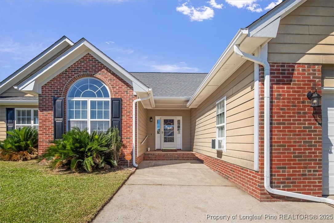 103 Beaumont Court Raeford, NC 28376 - Photo 7 of 50 a front view of a house with garden