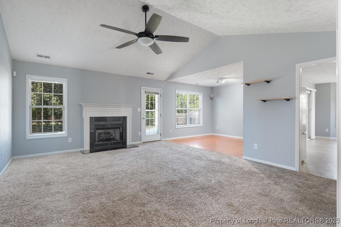 103 Beaumont Court Raeford, NC 28376 - Photo 10 of 50 a view of an empty room with a fireplace and a window