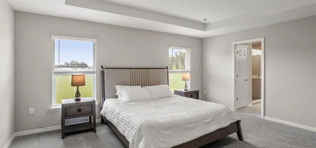 a bedroom with a bed and window