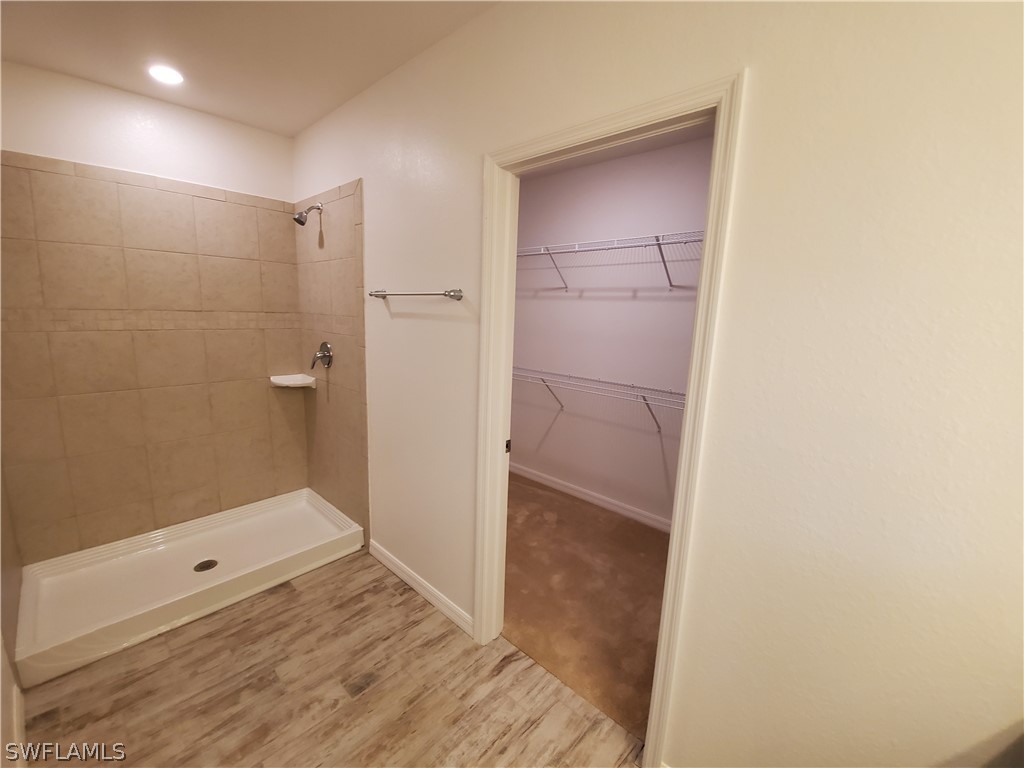 3916 Sunset Road Lehigh Acres, FL 33971 - Photo 4 of 11 a bathroom with a shower and a sink