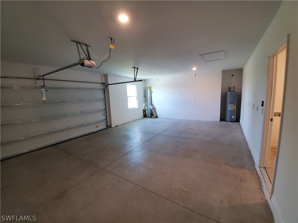 3916 Sunset Road Lehigh Acres, FL 33971 - Photo 8 of 11 a view of a hallway