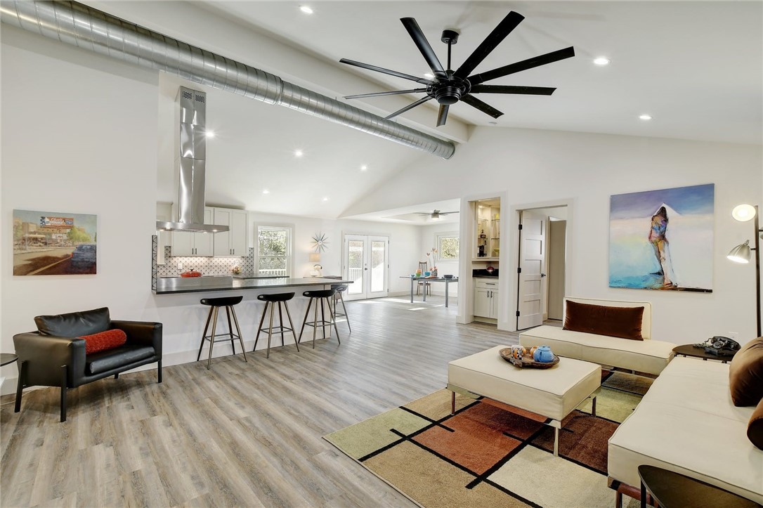 3305 South Pleasant Valley Road Austin, TX 78741 - Photo 1 of 1 a living room with furniture and a wooden floor