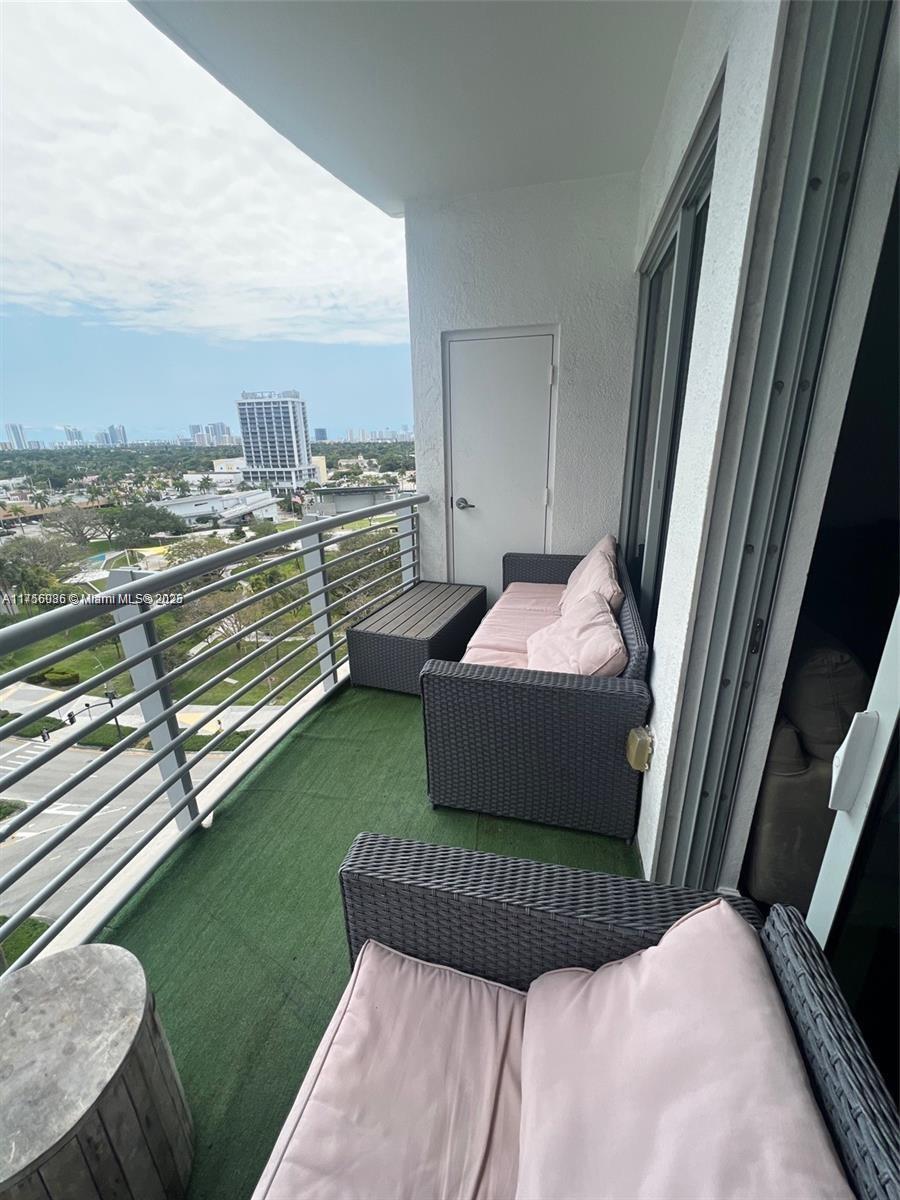 1830 Radius Drive, Unit 1123 Hollywood, FL 33020 - Photo 4 of 26 a bedroom with a bed and chair