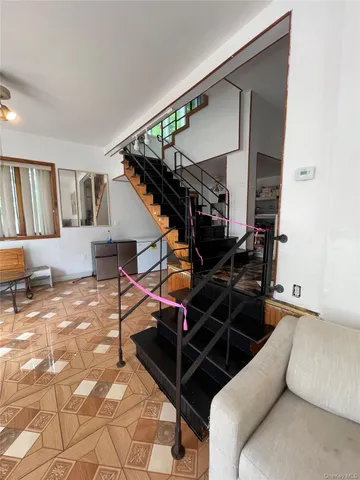 a view of a living room and entryway