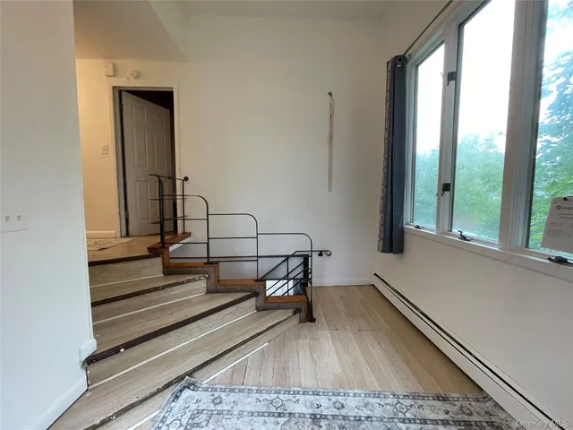 a view of wooden floor in a living room