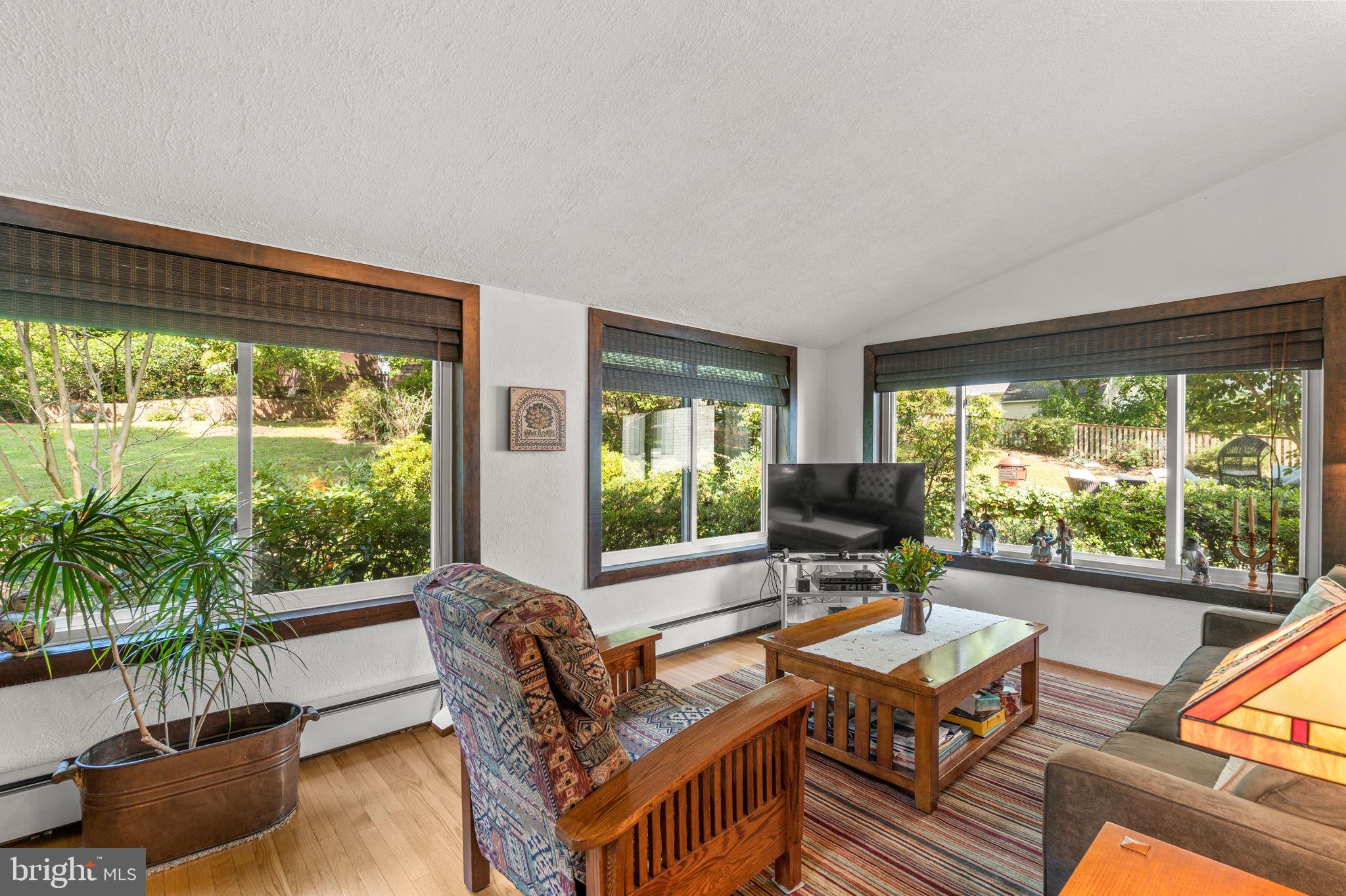 9508 Bruce Drive Silver Spring, MD 20901 - Photo 17 of 50 a living room with furniture tv and large windows
