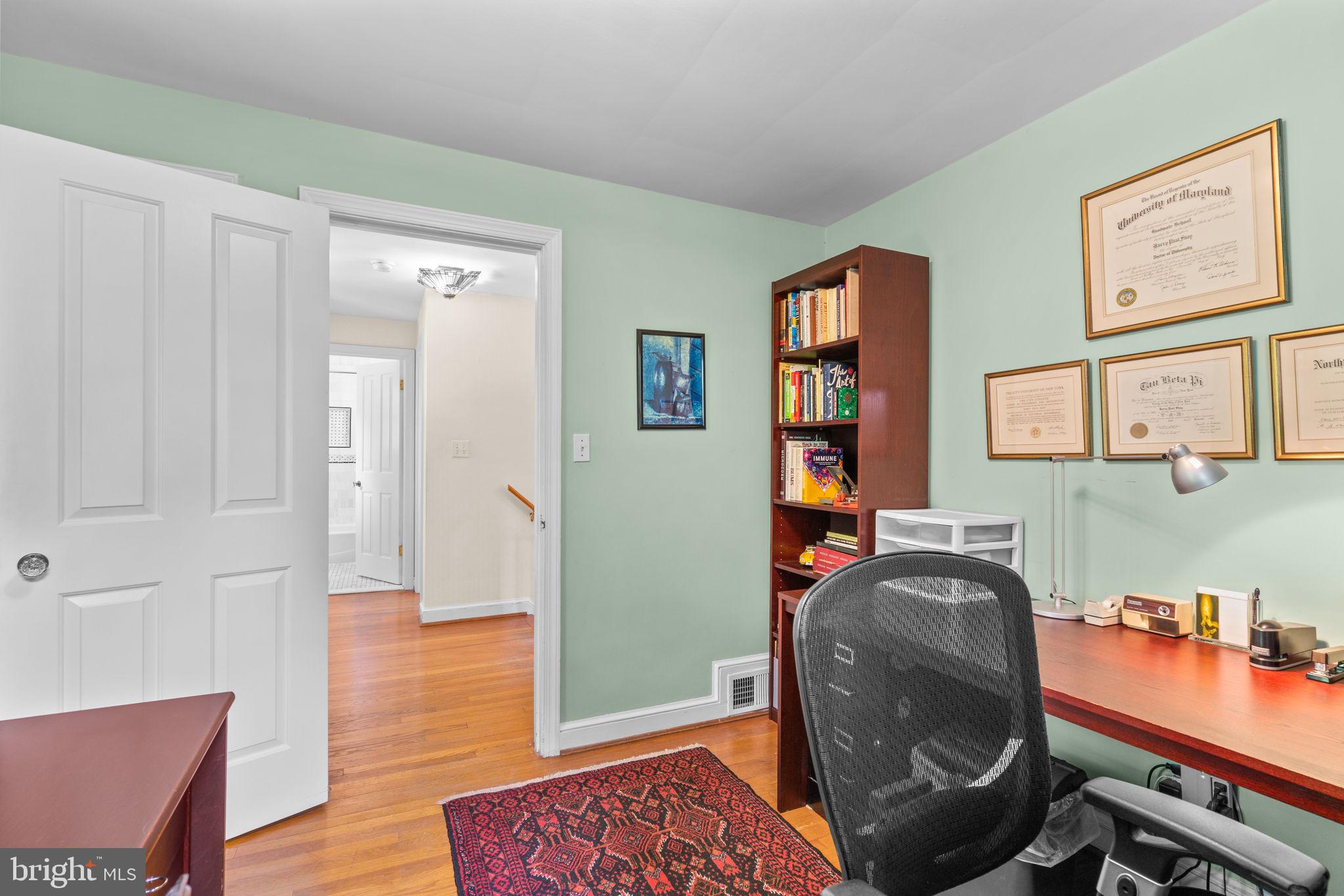 9508 Bruce Drive Silver Spring, MD 20901 - Photo 25 of 50 a view of a workspace with furniture and wooden floor