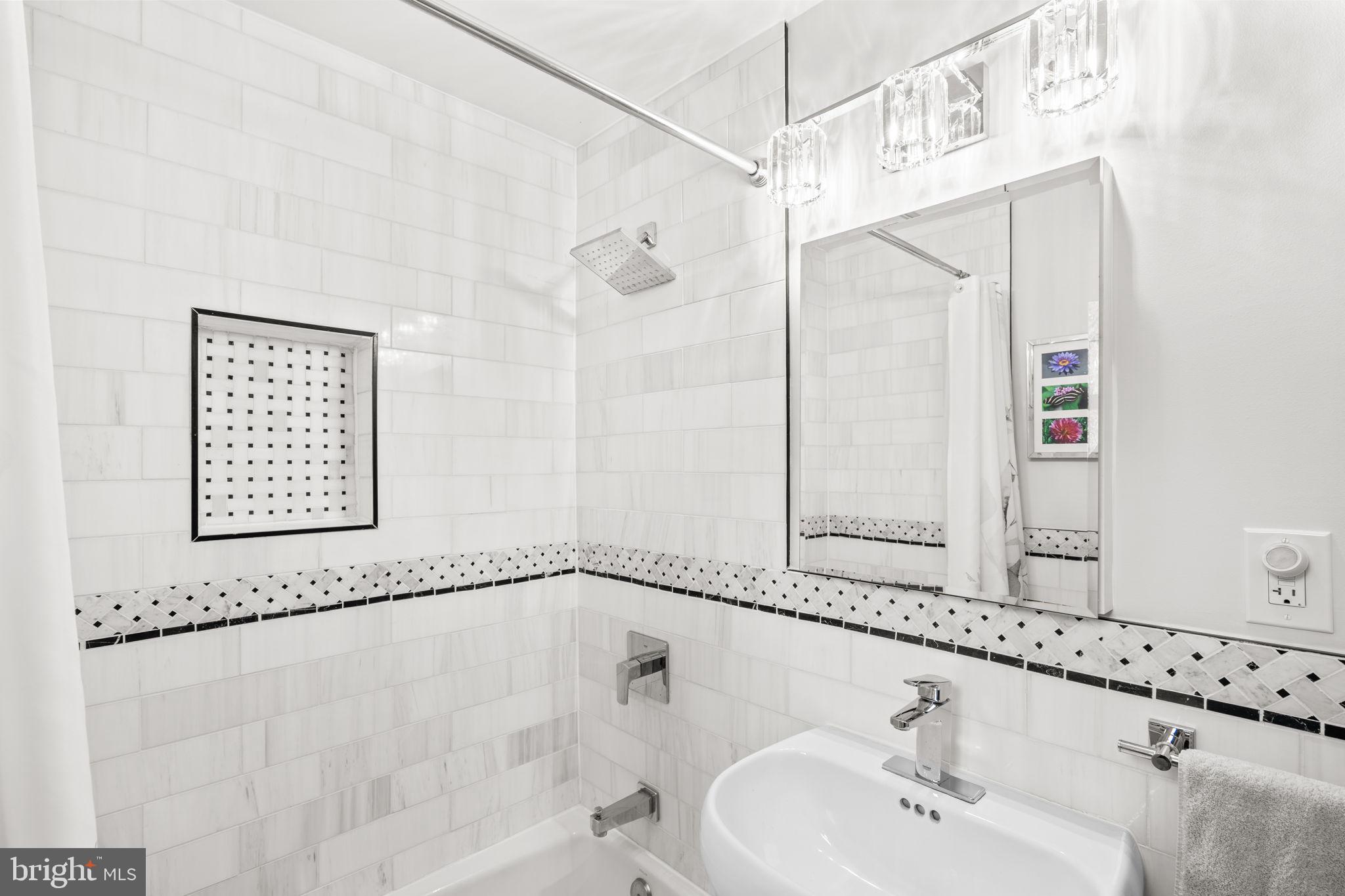 9508 Bruce Drive Silver Spring, MD 20901 - Photo 26 of 50 a bathroom with a bathtub and a sink