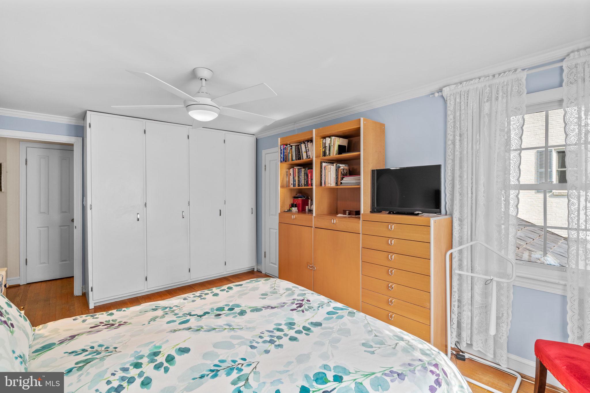 9508 Bruce Drive Silver Spring, MD 20901 - Photo 29 of 50 a bed room with a bed and a television