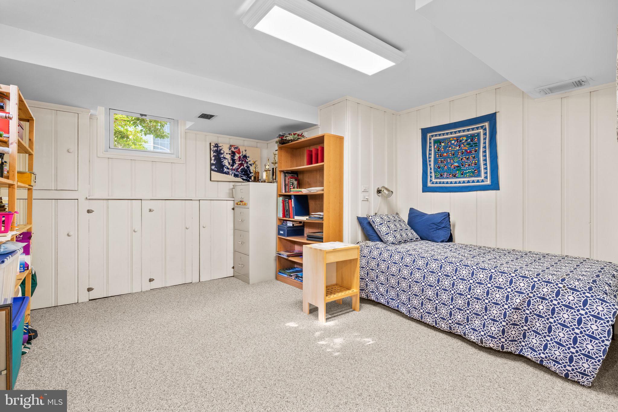 9508 Bruce Drive Silver Spring, MD 20901 - Photo 33 of 50 a bedroom with a bed and a couch