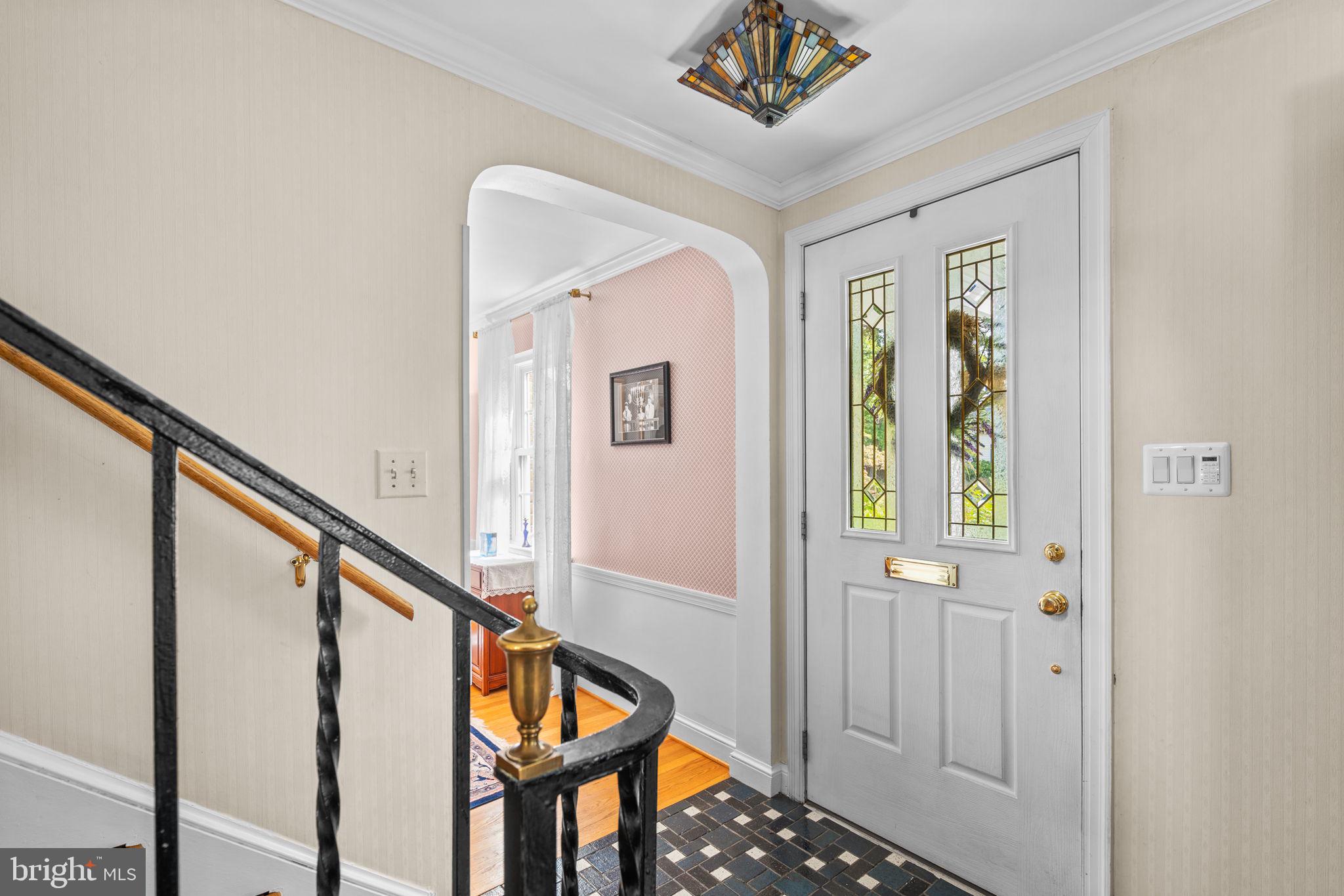 9508 Bruce Drive Silver Spring, MD 20901 - Photo 4 of 50 a front view of a house with wooden floor and door
