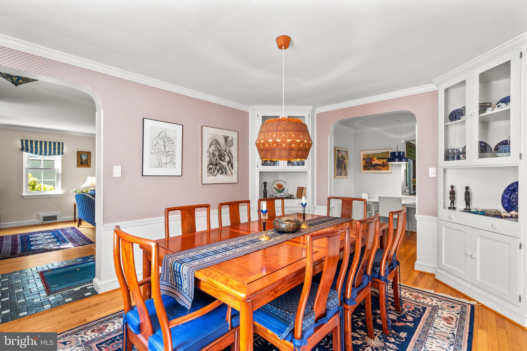 9508 Bruce Drive Silver Spring, MD 20901 - Photo 10 of 50 a living room with patio a dining table and chairs with wooden floor