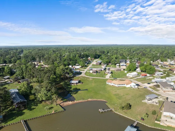 an aerial view of a house with a lake view