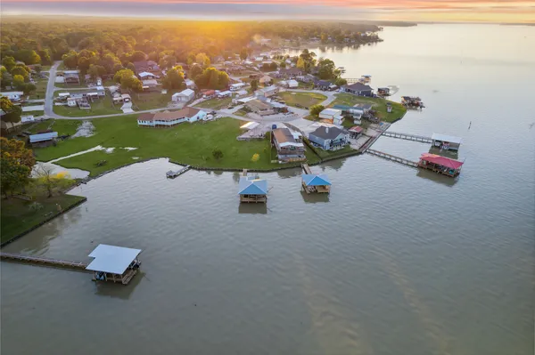 an aerial view of a house with a lake view