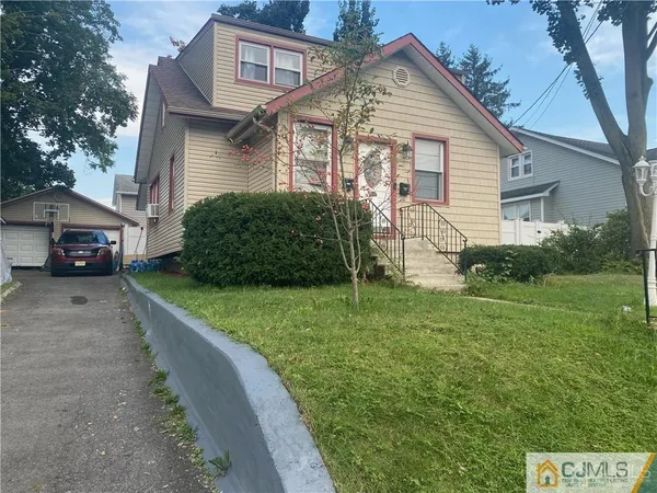 a view of a house with a back yard
