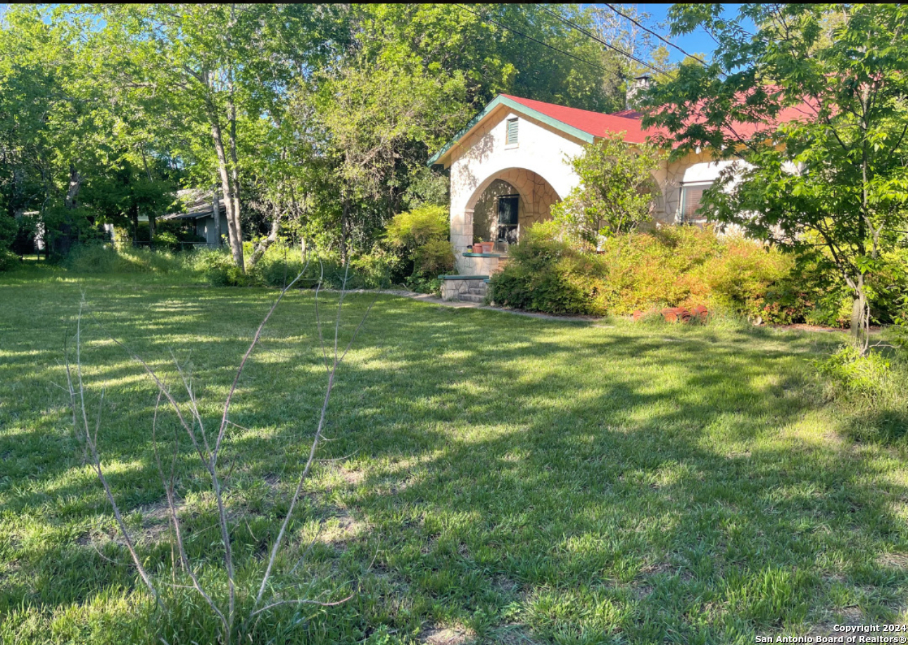 a view of a house with a park
