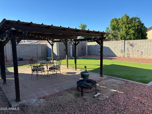 a view of a park with sitting area