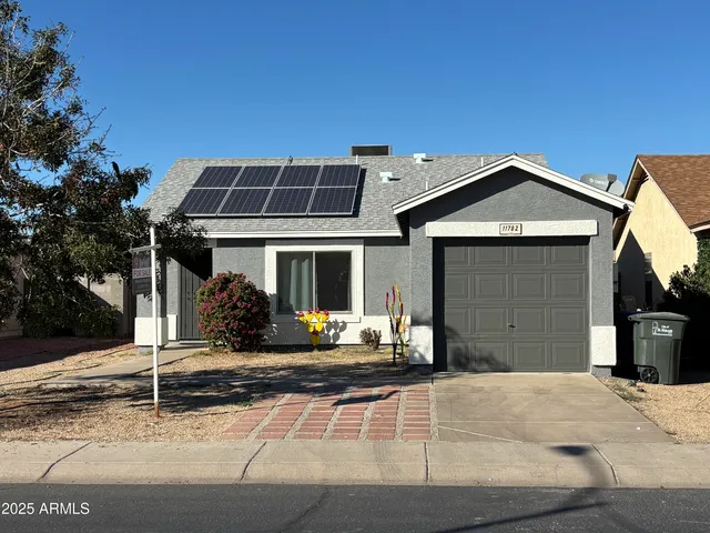 a front view of a house with yard