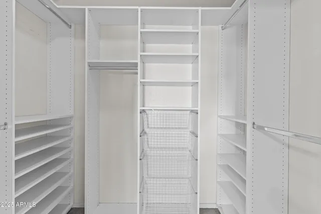 a dining room with wooden floor a glass table and chairs