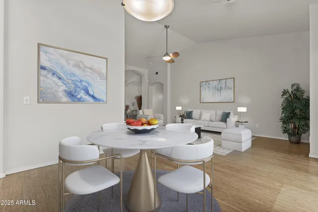 an aerial view of multiple houses with yard