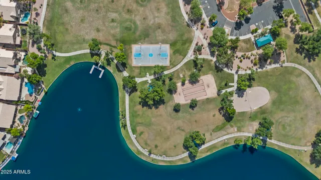 a view of a kitchen with a sink and refrigerator