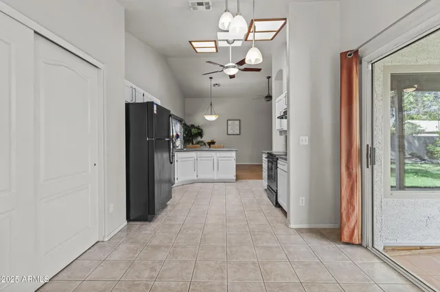 an empty room with windows and mountain view