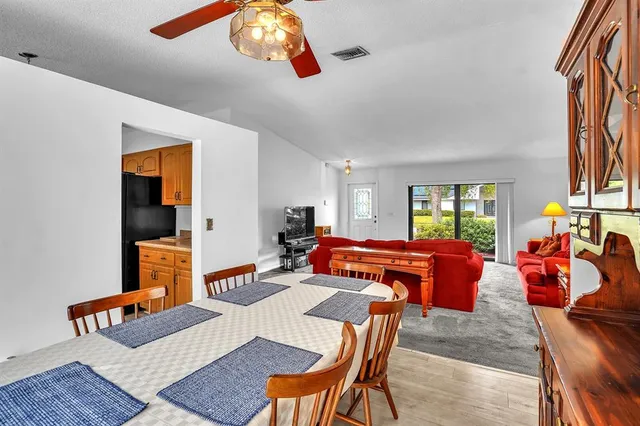 a living room with furniture a rug and a window