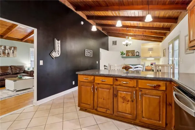a kitchen with stainless steel appliances granite countertop a sink and cabinets
