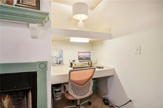 a room with a table chairs and a chandelier