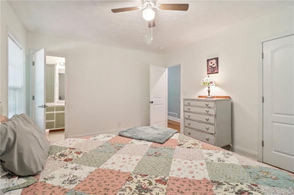 130 Carroll Street Temple, GA 30179 - Photo 18 of 30 a bedroom with a bed and a dresser