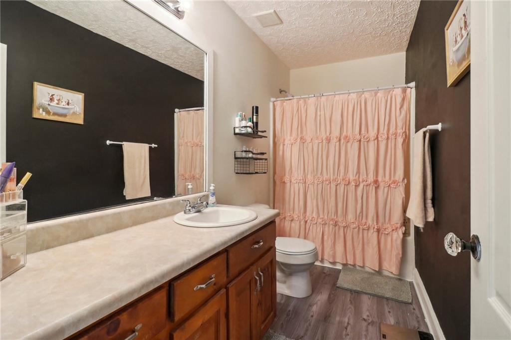 130 Carroll Street Temple, GA 30179 - Photo 22 of 30 a bathroom with a sink a toilet and shower