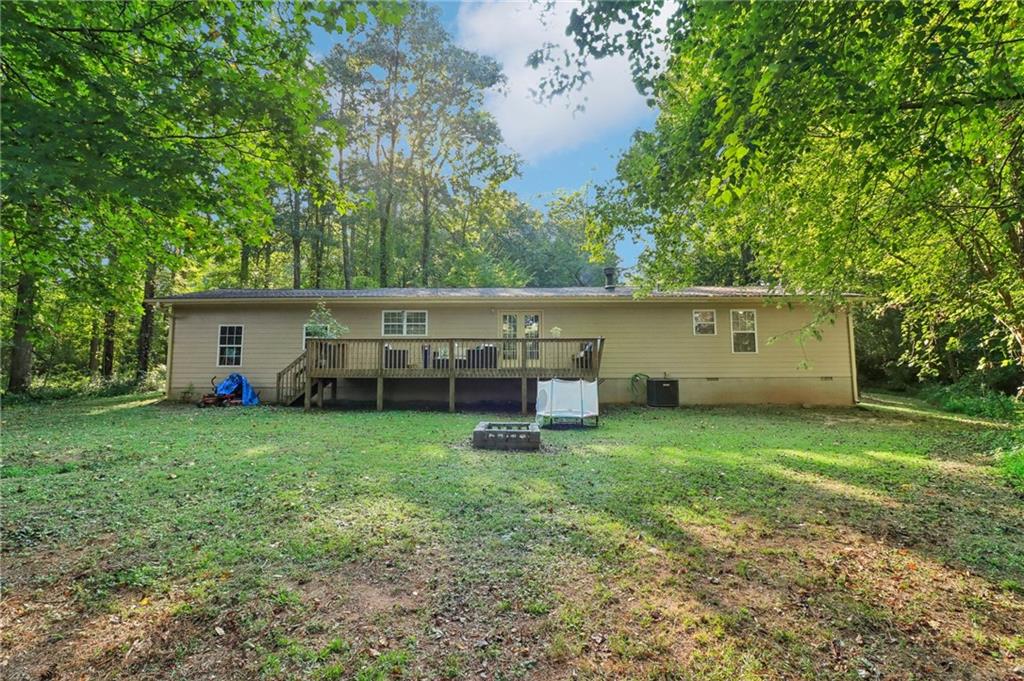 130 Carroll Street Temple, GA 30179 - Photo 28 of 30 a view of a house with backyard and a tree