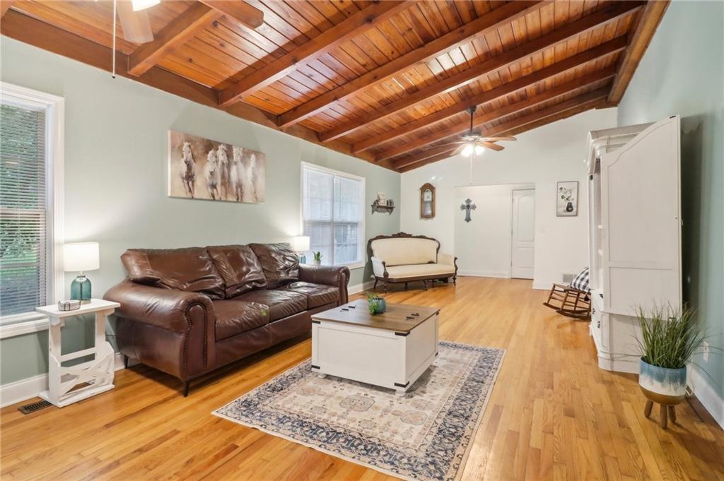 130 Carroll Street Temple, GA 30179 - Photo 3 of 30 a living room with furniture and a wooden floor