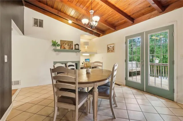 a view of a dining room with furniture and window