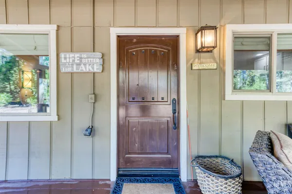 a hallway with front door wooden floor