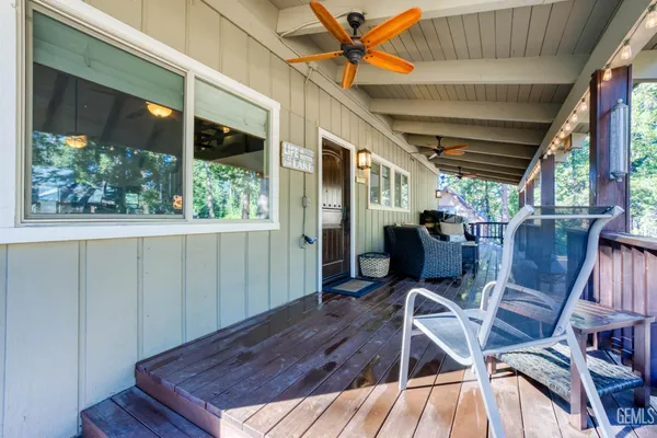 a view of a chairs and table in the patio