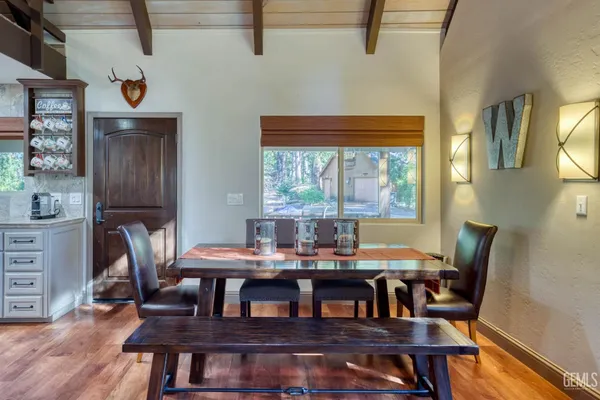 a view of a dining room with furniture window and wooden floor