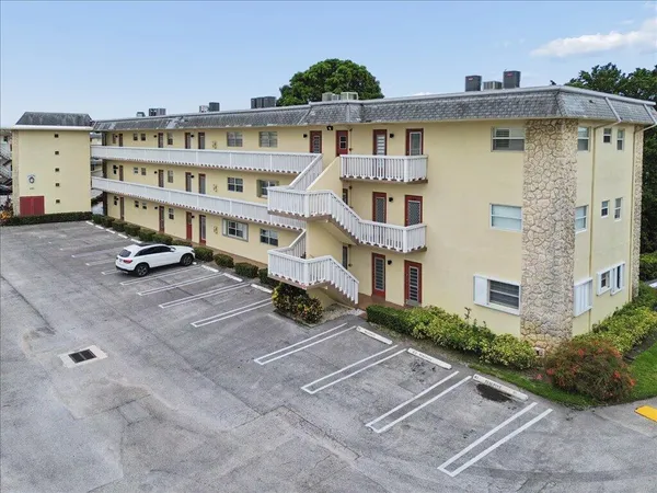 a view of a building with a yard
