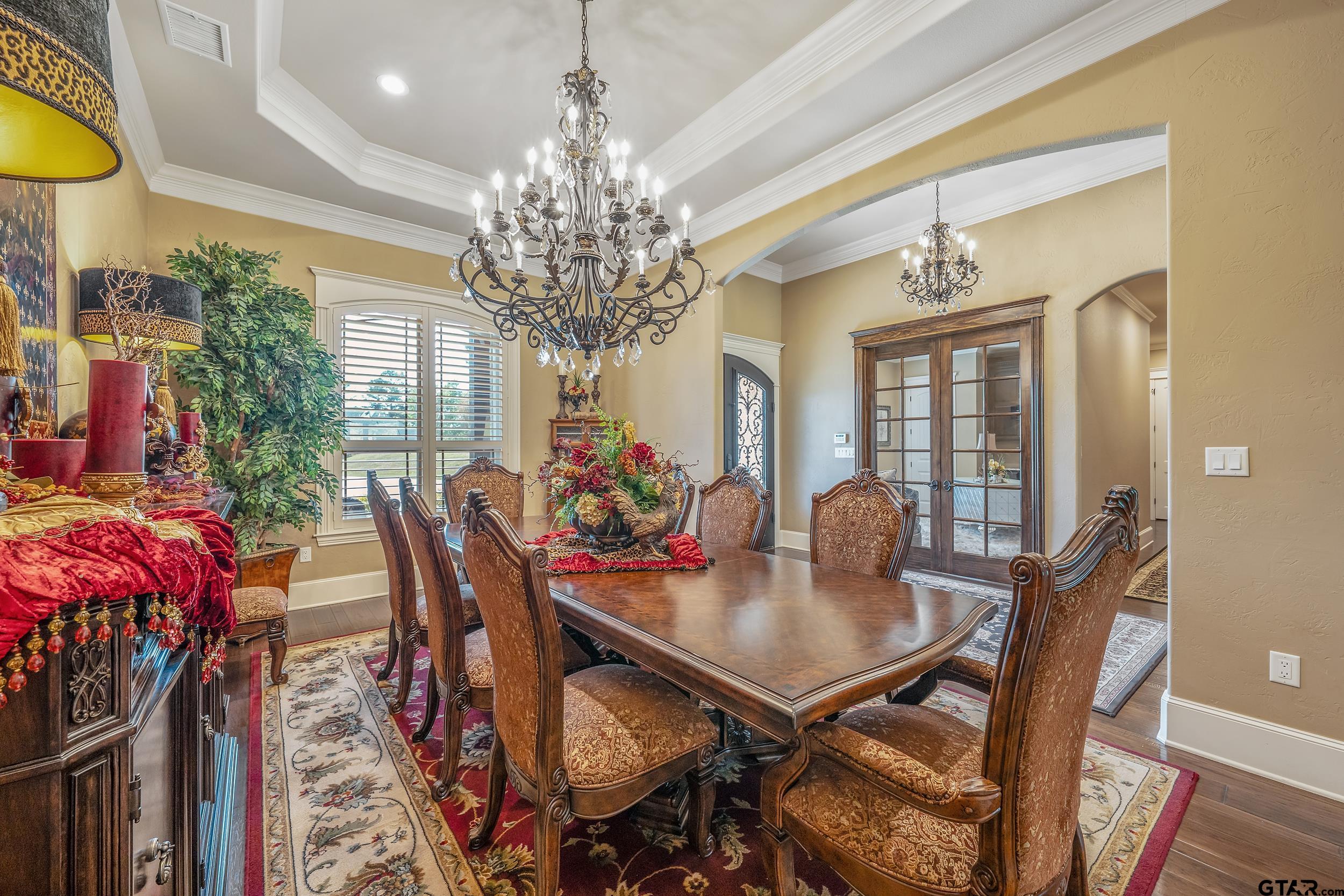 17521 Biltmore Circle Tyler, TX 75703 - Photo 18 of 48 a view of a dining room with furniture and chandelier