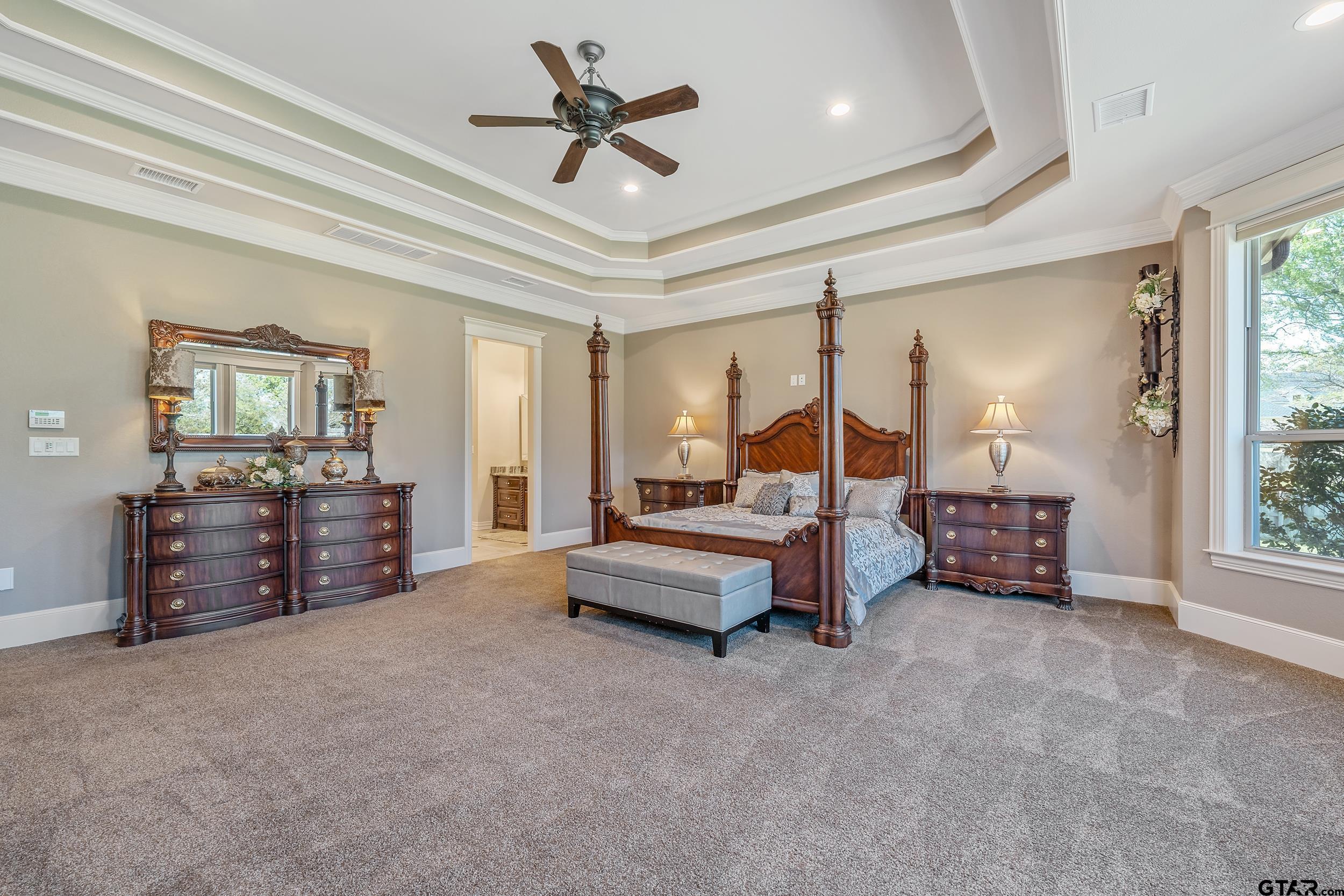 17521 Biltmore Circle Tyler, TX 75703 - Photo 20 of 48 a living room with furniture and a chandelier