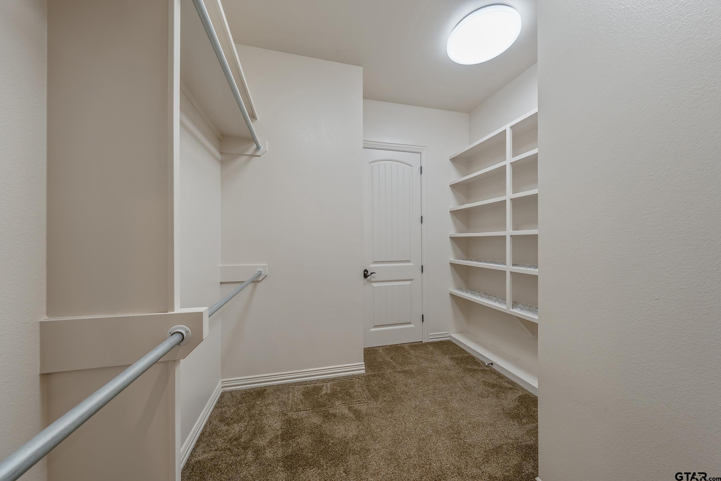 17521 Biltmore Circle Tyler, TX 75703 - Photo 29 of 48 a view of an empty walk in closet