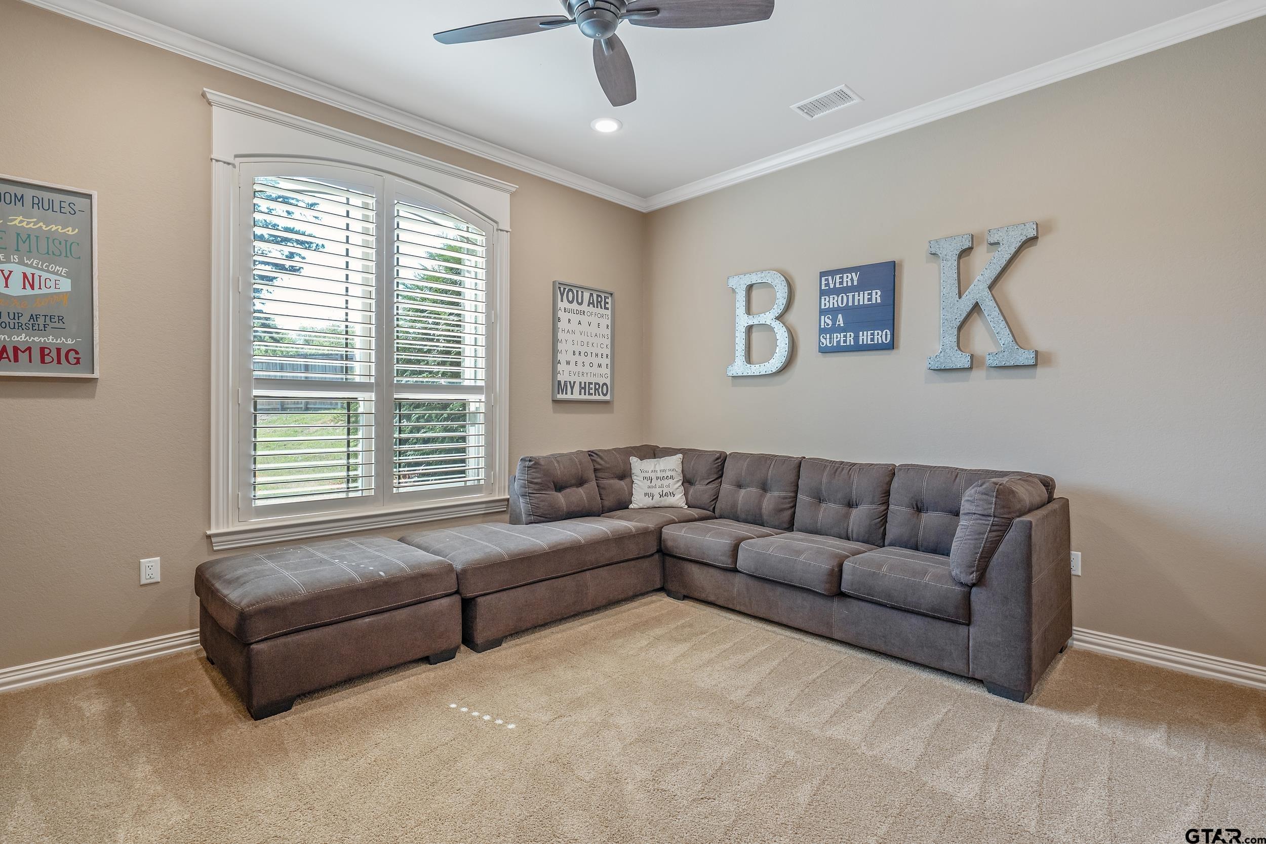 17521 Biltmore Circle Tyler, TX 75703 - Photo 30 of 48 a living room with furniture and a large window
