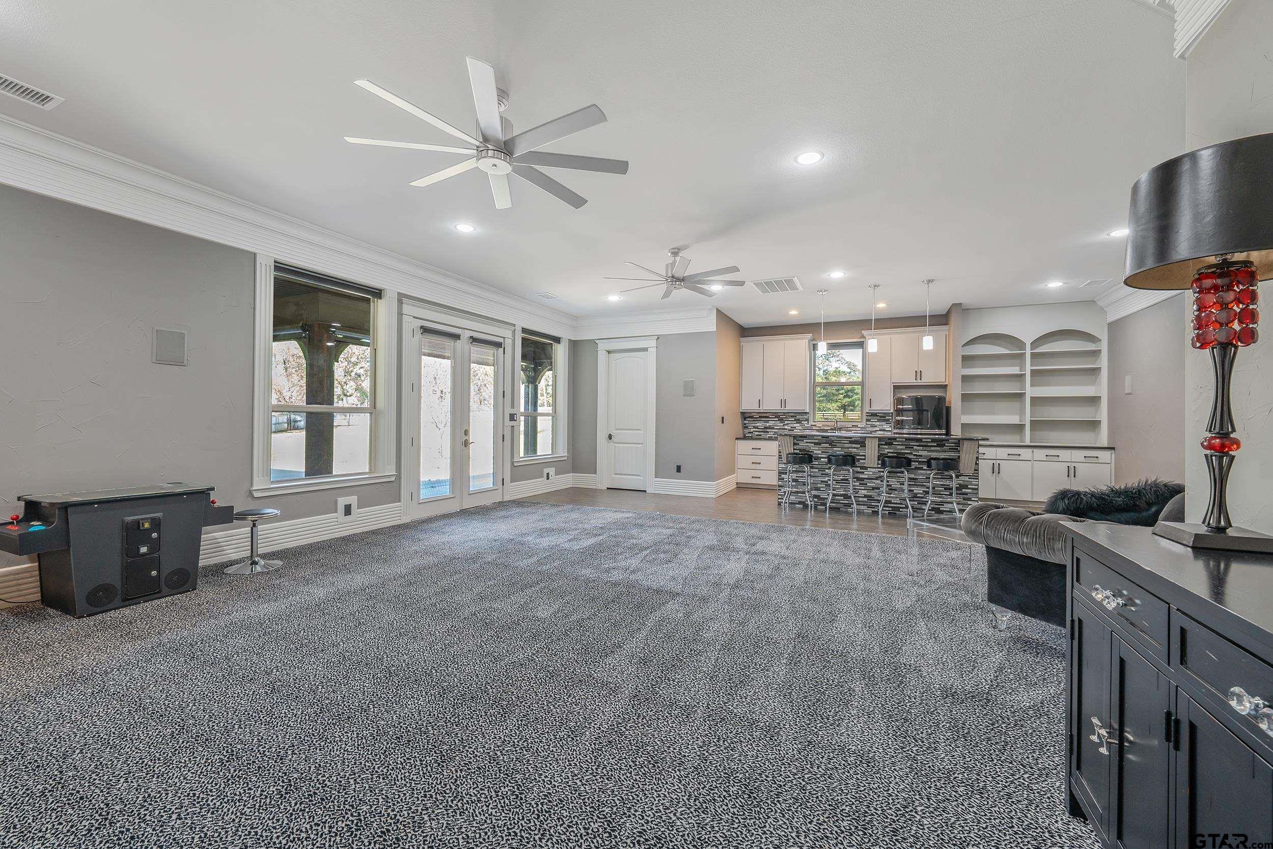 17521 Biltmore Circle Tyler, TX 75703 - Photo 35 of 48 a living room with furniture and a flat screen tv