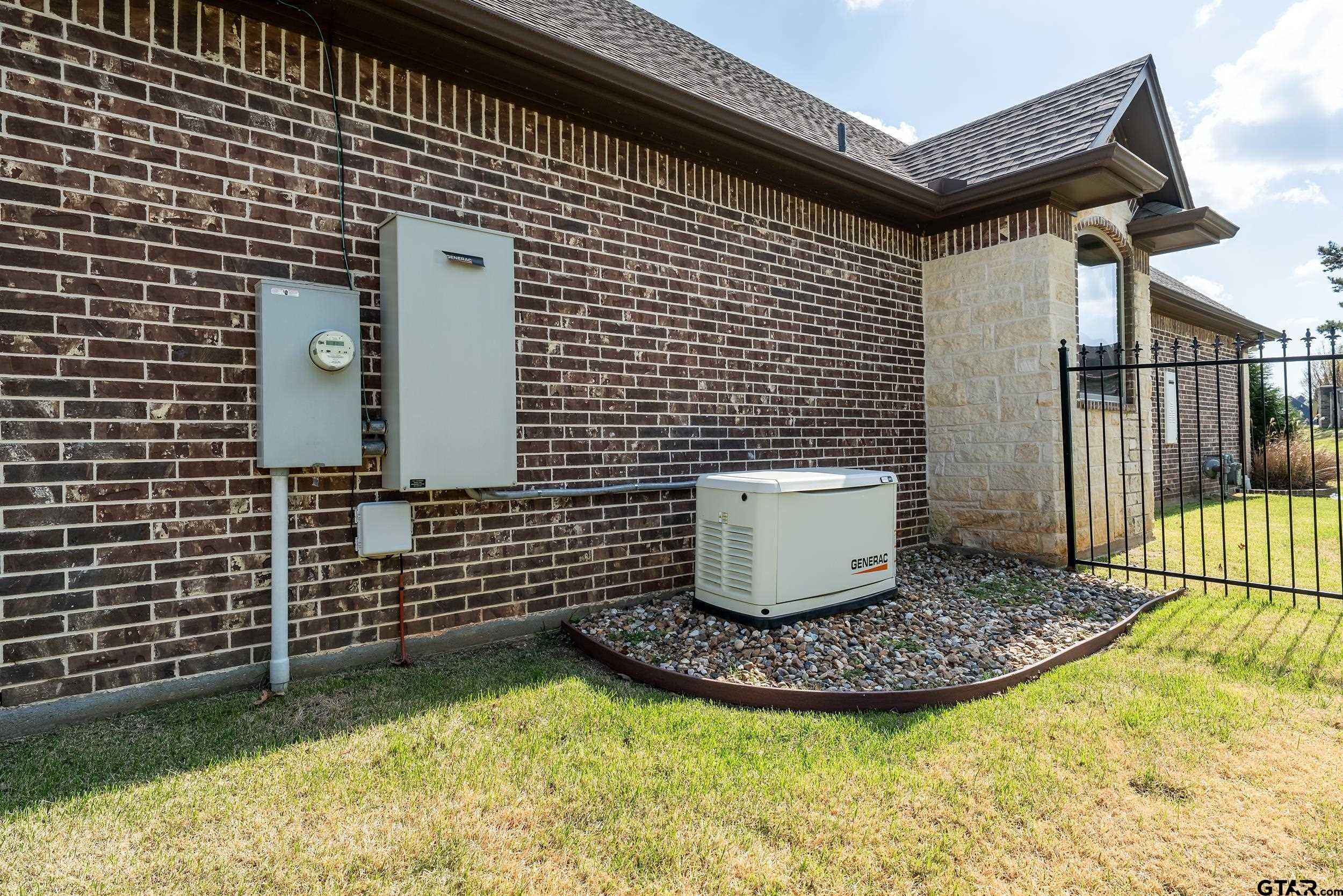 17521 Biltmore Circle Tyler, TX 75703 - Photo 45 of 48 a view of a brick house with wooden fence