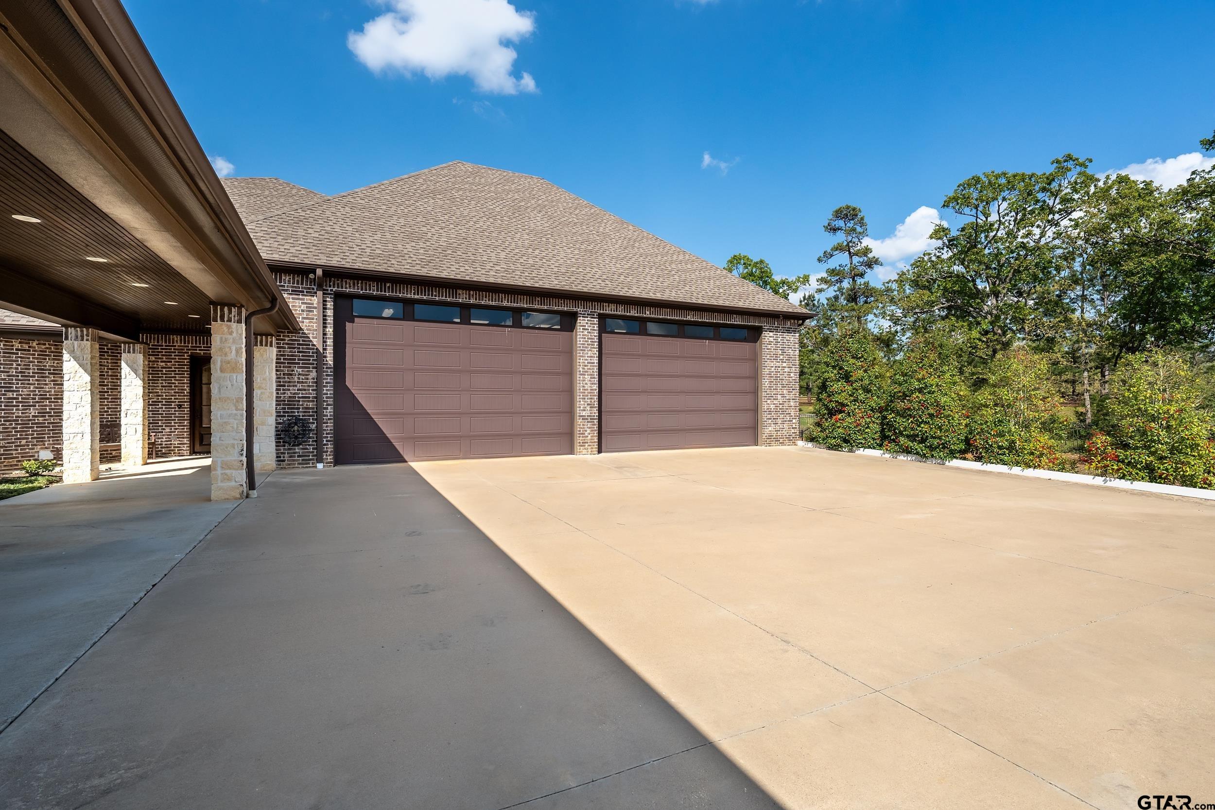 17521 Biltmore Circle Tyler, TX 75703 - Photo 46 of 48 a front view of a house with a garage