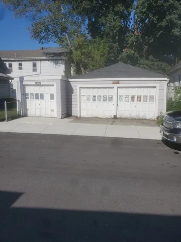 a view of building with car parked