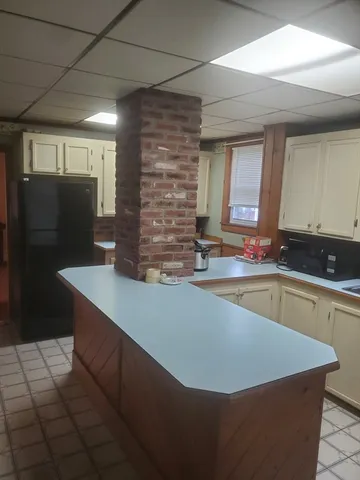 a view of kitchen with stainless steel appliances granite countertop a sink and a stove
