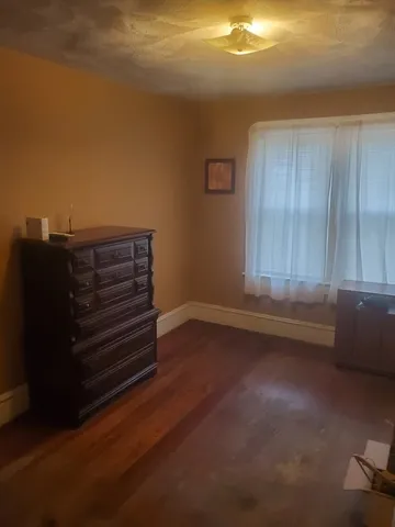 a view of room with hardwood floor