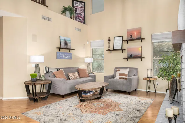 a living room with furniture and a fireplace
